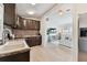Charming kitchen with wood cabinets and stainless steel appliances, open to the living area at 4030 Marlin Se Dr, St Petersburg, FL 33705