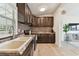Beautiful kitchen with wood cabinets, stylish backsplash, stainless appliances, and luxury flooring at 4030 Marlin Se Dr, St Petersburg, FL 33705