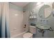 Charming bathroom featuring a bathtub, unique glass sink, and coastal-themed decor at 487 Pinellas Bayway S # 6, Tierra Verde, FL 33715