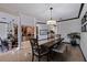 Dining room open to kitchen featuring a large dining table and bench seating, with a view of the kitchen at 487 Pinellas Bayway S # 6, Tierra Verde, FL 33715