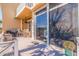 Outdoor lanai with a table and chairs, as well as a view of the pool and backyard at 487 Pinellas Bayway S # 6, Tierra Verde, FL 33715
