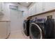 Well-organized laundry room with modern appliances, ample storage, and stylish decor at 487 Pinellas Bayway S # 6, Tierra Verde, FL 33715