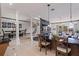 Open-concept living space with granite countertops and a stone accent wall with fireplace at 487 Pinellas Bayway S # 6, Tierra Verde, FL 33715