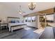 Spacious main bedroom with natural light, wood floors, and waterfront views at 487 Pinellas Bayway S # 6, Tierra Verde, FL 33715