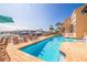 Beautiful pool with waterfront views, surrounded by lounge chairs, offering a serene outdoor retreat at 487 Pinellas Bayway S # 6, Tierra Verde, FL 33715