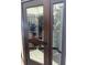 Custom wine cellar behind glass doors showcases ample storage and sophisticated design at 487 Pinellas Bayway S # 6, Tierra Verde, FL 33715