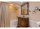 Traditional bathroom with a tub/shower combo, a decorative vanity, and a mirror at 487 Pinellas Bayway S # 6, Tierra Verde, FL 33715
