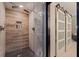 Bathroom featuring a glass enclosed walk-in shower and a barn door entrance at 487 Pinellas Bayway S # 6, Tierra Verde, FL 33715