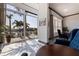 Bright living room with floor-to-ceiling windows and beautiful waterfront views at 487 Pinellas Bayway S # 6, Tierra Verde, FL 33715