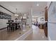 Open floor plan with tile floors, a dining area, living room, and staircase at 487 Pinellas Bayway S # 6, Tierra Verde, FL 33715
