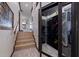 Hallway with wine cellar featuring a glass door and wooden wine racks at 487 Pinellas Bayway S # 6, Tierra Verde, FL 33715
