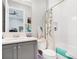 Bathroom featuring a shower-tub combo with a grey vanity sink and a shower curtain at 4926 Pamplona Ct, Wimauma, FL 33598