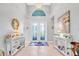 Inviting foyer with grand entrance, high ceilings, and elegant decor accents at 4926 Pamplona Ct, Wimauma, FL 33598