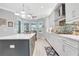 Beautiful kitchen with a center island, modern lighting, and breakfast area for Gathering meals at 4926 Pamplona Ct, Wimauma, FL 33598
