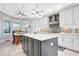 Modern kitchen featuring stainless steel appliances, granite countertops, and custom backsplash at 4926 Pamplona Ct, Wimauma, FL 33598
