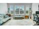 Bright living area with large windows and custom shutters for natural light and privacy at 4926 Pamplona Ct, Wimauma, FL 33598