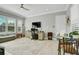 Bright and airy home office with natural light, providing a serene workspace for productivity at 4926 Pamplona Ct, Wimauma, FL 33598