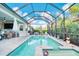 Inviting screened pool with a covered lanai, perfect for relaxing and entertaining with stunning views at 4926 Pamplona Ct, Wimauma, FL 33598