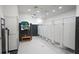 Modern restroom features sleek black and white design, with multiple stalls and lockers for convenience at 4926 Pamplona Ct, Wimauma, FL 33598