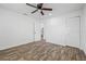 Bright bedroom featuring a ceiling fan, closet and ensuite bathroom access at 501 W Bird St, Tampa, FL 33604