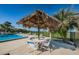 Relaxing poolside lounge area with comfortable seating and tropical ambiance at 507 Windrush Bay Dr # 507, Tarpon Springs, FL 34689