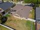 Aerial view of a well-maintained property with a large backyard and screened-in patio at 5123 Whispering Leaf Trl, Valrico, FL 33596
