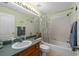 This bathroom includes a shower/tub combination and neutral-toned tile flooring at 5123 Whispering Leaf Trl, Valrico, FL 33596