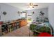 This bedroom is decorated with sports theming and features a dresser and bookcase at 5123 Whispering Leaf Trl, Valrico, FL 33596
