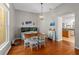 Well-lit dining area featuring a wooden table, chairs, and a charming aquarium as a decorative feature at 5123 Whispering Leaf Trl, Valrico, FL 33596