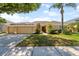 Charming single-story home featuring a well-manicured lawn and a two-car garage at 5123 Whispering Leaf Trl, Valrico, FL 33596
