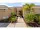Inviting front entrance featuring lush landscaping and a welcoming door perfect for any homeowner at 5123 Whispering Leaf Trl, Valrico, FL 33596