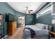 Comfortable main bedroom with a ceiling fan, natural light, and sliding glass doors at 5123 Whispering Leaf Trl, Valrico, FL 33596