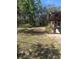 Home with spacious backyard featuring a storage shed at 5425 Leisure St, Dade City, FL 33523