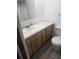Well-lit bathroom with a vanity and modern fixtures and neutral decor at 5425 Leisure St, Dade City, FL 33523