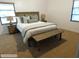 Comfortable bedroom features a neutral color scheme and dual windows for natural light at 5425 Leisure St, Dade City, FL 33523