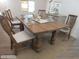 Traditional dining room boasts a solid wood table, ideal for Gathering meals at 5425 Leisure St, Dade City, FL 33523