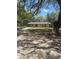 Charming single-story home with a well-manicured front lawn and mature trees at 5425 Leisure St, Dade City, FL 33523