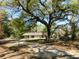 Charming single-story home with a large mature tree shading the property at 5425 Leisure St, Dade City, FL 33523