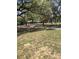 A cozy single-Gathering home featuring a spacious yard and mature trees providing ample shade at 5425 Leisure St, Dade City, FL 33523