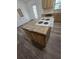 Practical kitchen island with cooktop offering plenty of room for cooking and storage at 5425 Leisure St, Dade City, FL 33523