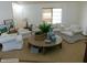 Bright living room features cozy furniture and a large window, providing ample natural light at 5425 Leisure St, Dade City, FL 33523