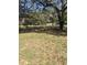 View of a residential lot featuring mature trees and natural scenery, offering a tranquil and private setting at 5425 Leisure St, Dade City, FL 33523