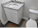 Updated bathroom features a granite countertop, new vanity with white cabinets, and modern fixtures at 5725 80Th N St # 314, St Petersburg, FL 33709