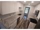 Bright kitchen features stainless steel appliances, white cabinets and beautiful granite countertops at 5725 80Th N St # 314, St Petersburg, FL 33709