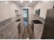 Modern kitchen with white cabinets, granite countertops, and stainless steel appliances at 5725 80Th N St # 314, St Petersburg, FL 33709