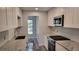 Granite countertops paired with stainless steel appliances and bright lighting create an inviting kitchen space at 5725 80Th N St # 314, St Petersburg, FL 33709