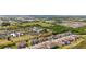 A beautiful aerial view of a neighborhood featuring well-maintained homes and green spaces, near local amenities at 607 Royal Empress Dr, Ruskin, FL 33570