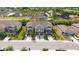 Wide aerial view showing the neighborhood and landscaping of the townhouses at 607 Royal Empress Dr, Ruskin, FL 33570