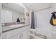 This bathroom features a single sink vanity with gray granite countertop and a shower/tub combo at 607 Royal Empress Dr, Ruskin, FL 33570