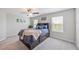 Bedroom with soft carpet, natural light, ceiling fan, and warm decor at 607 Royal Empress Dr, Ruskin, FL 33570